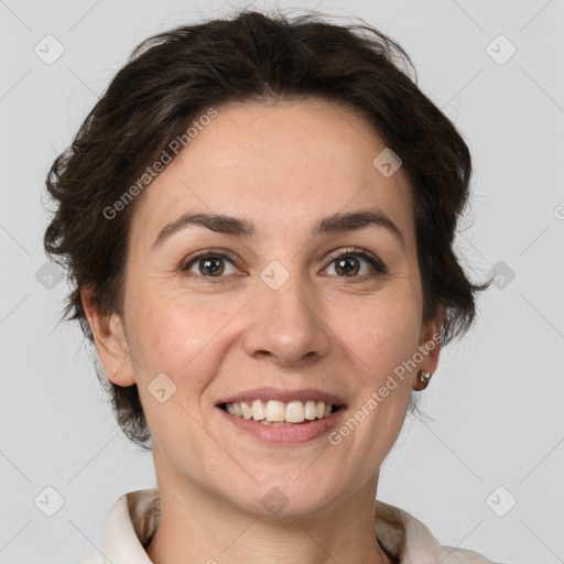 Joyful white adult female with medium  brown hair and grey eyes