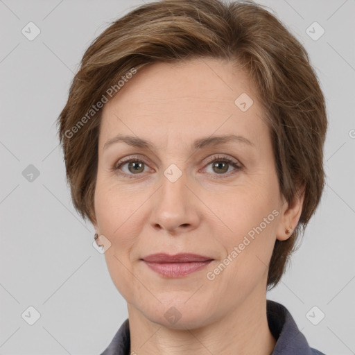 Joyful white adult female with medium  brown hair and grey eyes