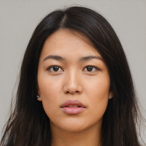 Neutral latino young-adult female with long  brown hair and brown eyes
