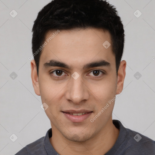 Joyful white young-adult male with short  black hair and brown eyes