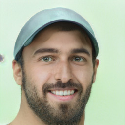 Joyful white young-adult male with short  brown hair and green eyes