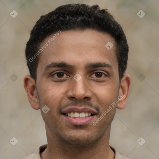 Joyful black young-adult male with short  black hair and brown eyes