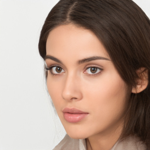 Neutral white young-adult female with long  brown hair and brown eyes