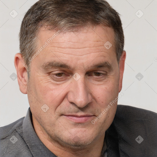 Joyful white middle-aged male with short  brown hair and brown eyes