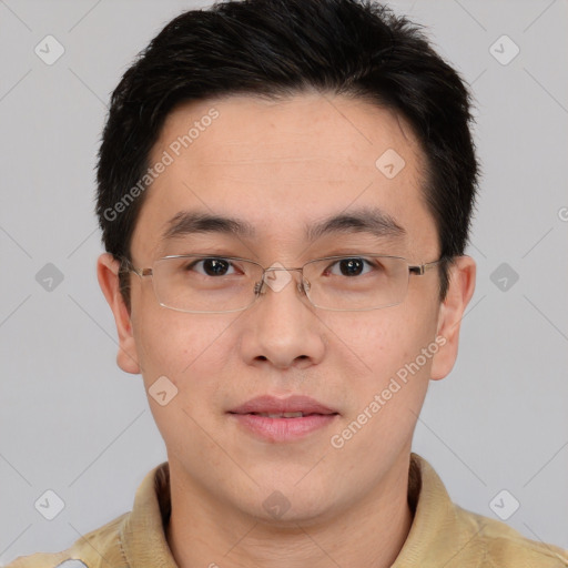 Joyful asian young-adult male with short  brown hair and brown eyes