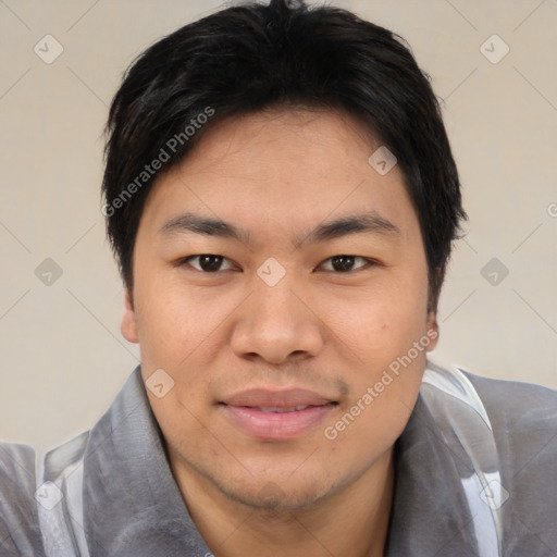 Joyful asian young-adult male with short  black hair and brown eyes