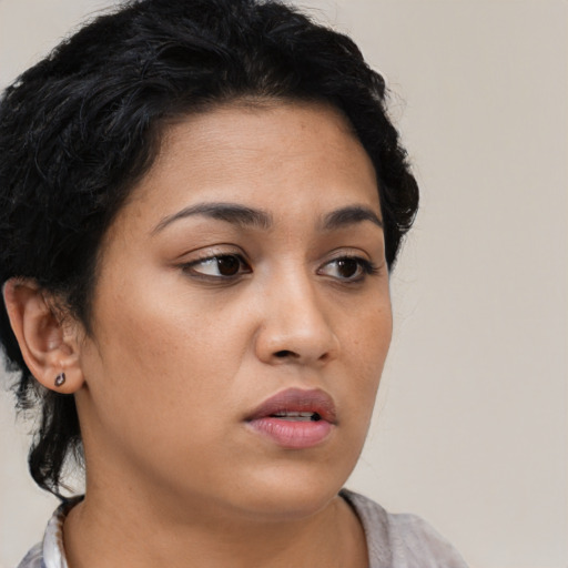 Neutral latino young-adult female with short  black hair and brown eyes