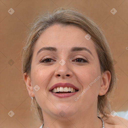 Joyful white adult female with medium  brown hair and brown eyes