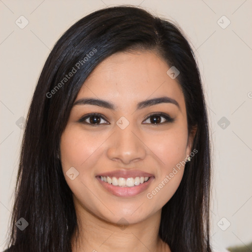 Joyful latino young-adult female with long  brown hair and brown eyes