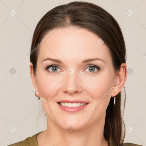 Joyful white young-adult female with medium  brown hair and grey eyes