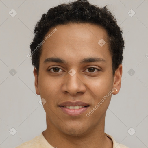 Joyful latino young-adult male with short  brown hair and brown eyes