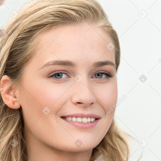 Joyful white young-adult female with long  brown hair and blue eyes