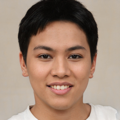 Joyful asian young-adult female with short  black hair and brown eyes