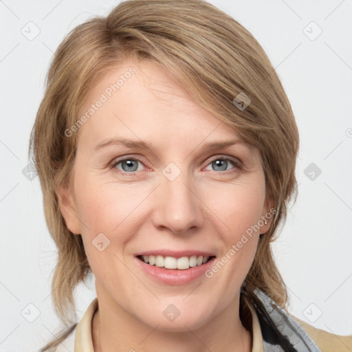 Joyful white young-adult female with medium  brown hair and blue eyes