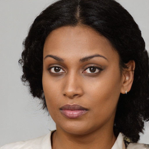 Neutral black young-adult female with medium  black hair and brown eyes