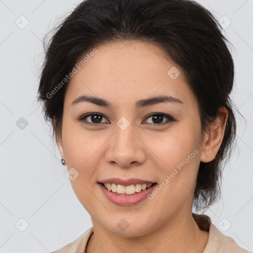 Joyful latino young-adult female with medium  brown hair and brown eyes