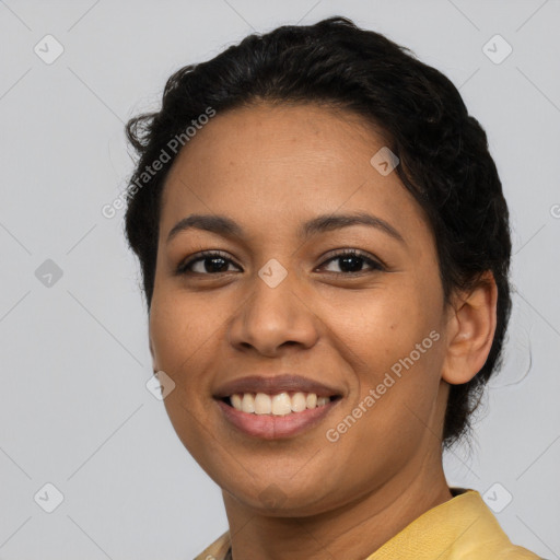 Joyful latino young-adult female with short  black hair and brown eyes