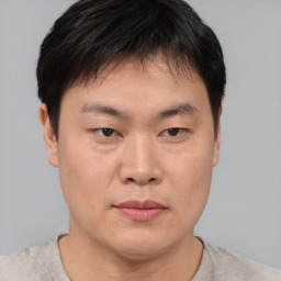 Neutral asian young-adult male with short  brown hair and brown eyes