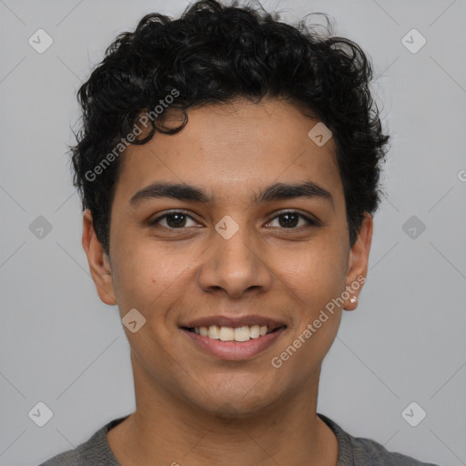 Joyful latino young-adult male with short  brown hair and brown eyes