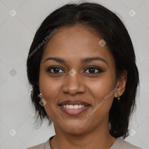 Joyful black young-adult female with medium  brown hair and brown eyes