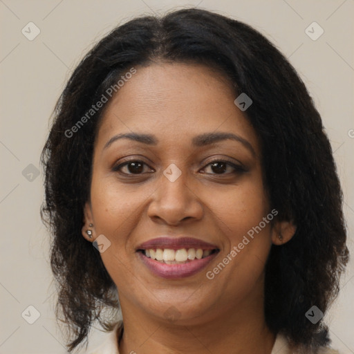 Joyful black young-adult female with medium  brown hair and brown eyes