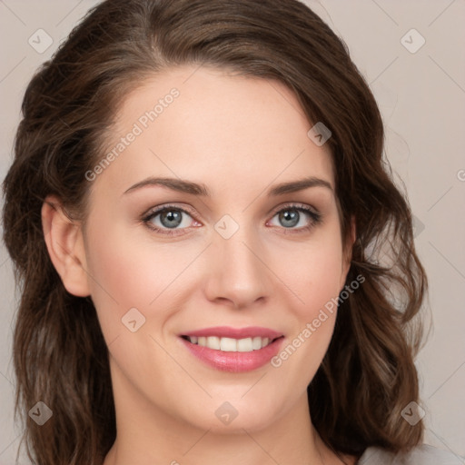 Joyful white young-adult female with medium  brown hair and green eyes