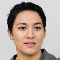 Joyful asian young-adult female with short  black hair and brown eyes