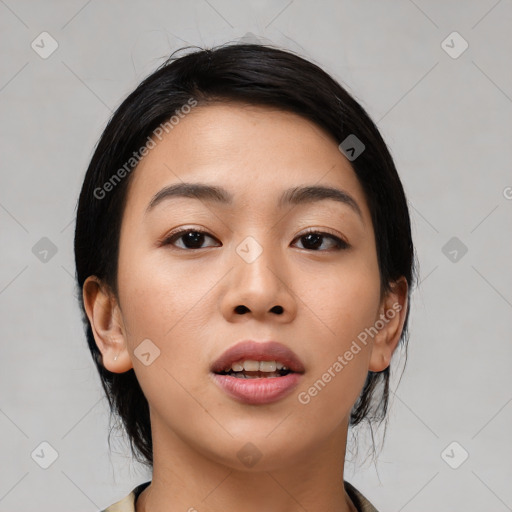 Joyful asian young-adult female with medium  black hair and brown eyes