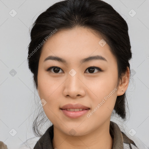 Joyful asian young-adult female with medium  black hair and brown eyes