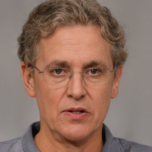 Joyful white middle-aged male with short  brown hair and blue eyes