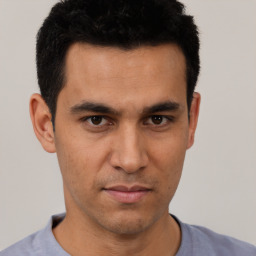 Neutral asian young-adult male with short  brown hair and brown eyes