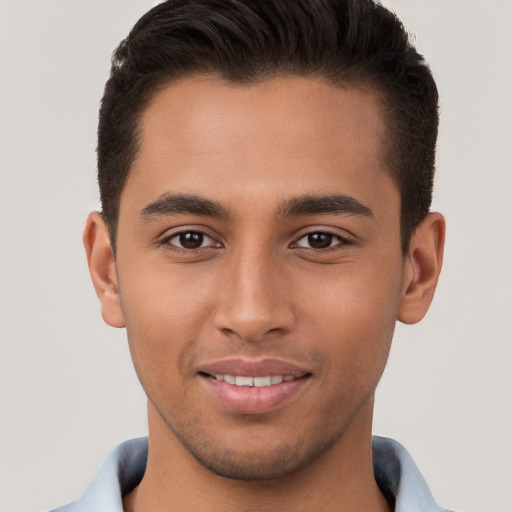 Joyful white young-adult male with short  brown hair and brown eyes