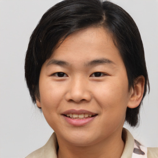Joyful asian young-adult female with medium  brown hair and brown eyes