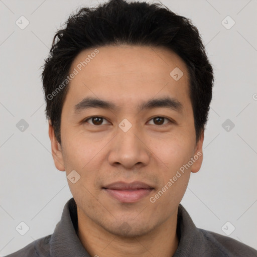 Joyful latino young-adult male with short  black hair and brown eyes