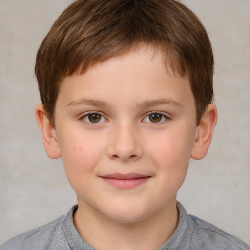 Joyful white child male with short  brown hair and brown eyes