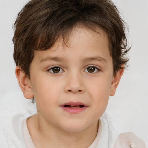 Joyful white child male with short  brown hair and brown eyes