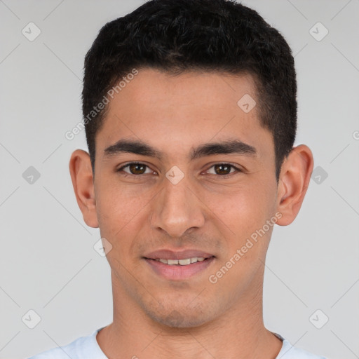 Joyful white young-adult male with short  black hair and brown eyes