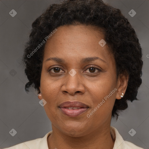 Joyful black adult female with short  brown hair and brown eyes