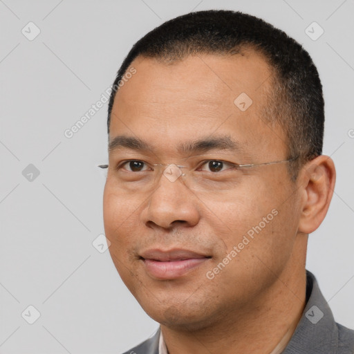 Joyful white adult male with short  black hair and brown eyes