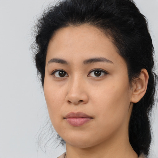Neutral latino young-adult female with medium  brown hair and brown eyes