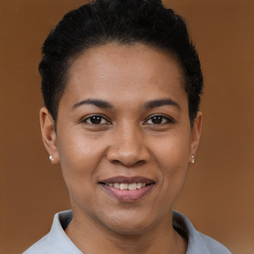 Joyful black young-adult female with short  black hair and brown eyes