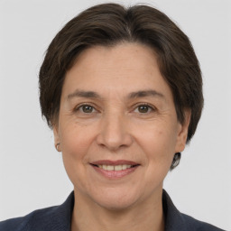 Joyful white adult female with short  brown hair and brown eyes