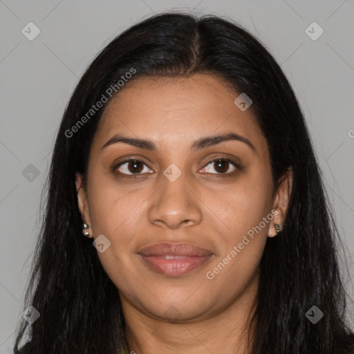 Joyful black young-adult female with long  brown hair and brown eyes