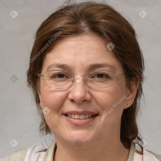 Joyful white adult female with medium  brown hair and blue eyes