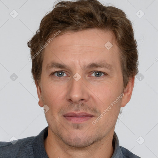 Joyful white adult male with short  brown hair and grey eyes