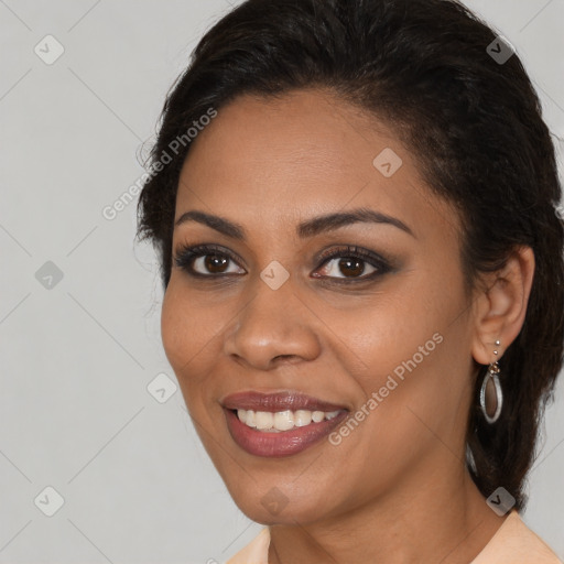 Joyful latino young-adult female with medium  brown hair and brown eyes