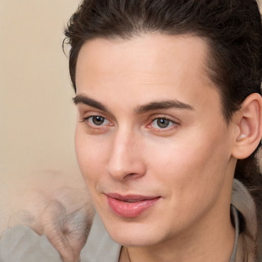 Joyful white young-adult male with medium  brown hair and brown eyes