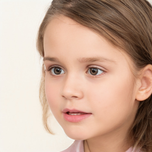 Joyful white child female with long  brown hair and brown eyes