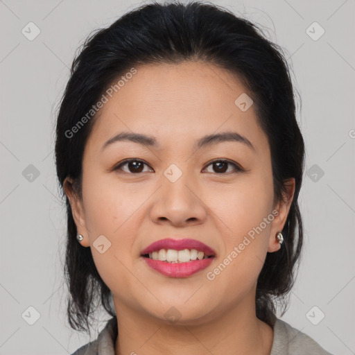 Joyful asian young-adult female with medium  brown hair and brown eyes