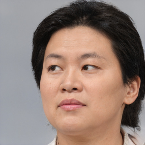 Neutral asian adult female with medium  brown hair and brown eyes